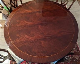 GORGEOUS Maitland-Smith flame mahogany round dining table, with clip-on leaves that increase the diameter from 59" to 84"; includes four leaves and magnetic table protectors.