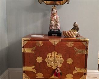 Wonderful vintage Asian wooden chest, with brass hardware - great size!                                                                  Asian porcelain table lamp and earthenware monkey, with banana bunch.