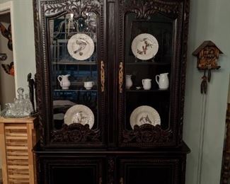 Huge, hand-carved ebonized wood china cabinet, by Habersham Furn. Co., of Clarksville, GA; measures 94"T x 51"W x 23" D.