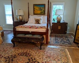 Vintage queen size carved mahogany rice bed, with matelassé cover and custom bedskirt, pair of Henredon wooden chests, with pair of capiz shell table lamps and framed original oil on canvas by GA Tech professor, Robert Dejanes.