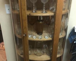 oak curio with glassware