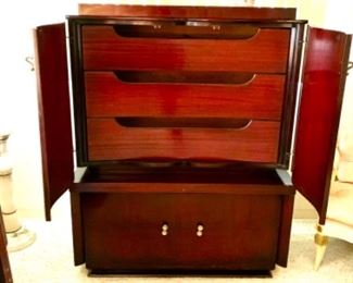 qThe large bottom drawer pulls out into cedar storage