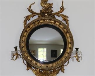 Exceptional antique bullseye mirror with dolphin carved crest and candles