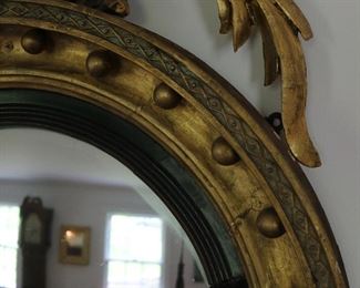 Exceptional antique bullseye mirror with dolphin carved crest and candles