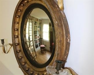 Exceptional antique bullseye mirror with dolphin carved crest and candles