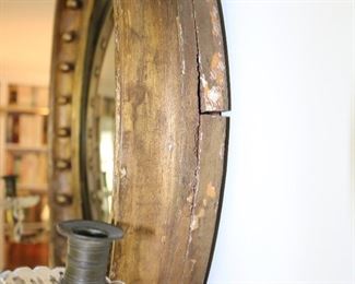 Exceptional antique bullseye mirror with dolphin carved crest and candles