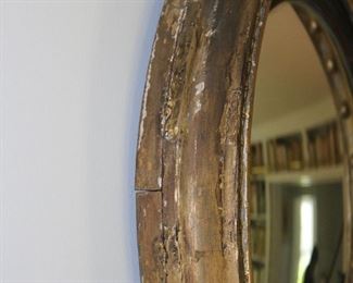 Exceptional antique bullseye mirror with dolphin carved crest and candles