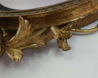 Exceptional antique bullseye mirror with dolphin carved crest and candles