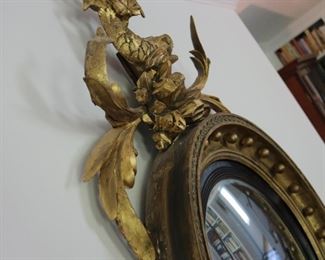 Exceptional antique bullseye mirror with dolphin carved crest and candles