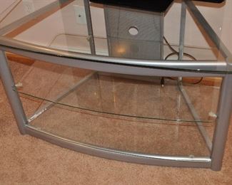 MATT SILVER AND GLASS  TV STAND BY POWELL, 40"W X 22.5"D X 23.5"H.  OUR PRICE IS $75.00.