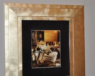 GOLD TONED FRAME WITH A LIVING ROOM PHOTO PRINT, 21"W X 23"H.  OUR PRICE IS $60.00.