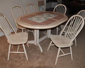 WHITEWASHED COLORMETRICS DINING TABLE WITH TRIPLE TRIANGLE INSERTS, ROSE BORDER WITH WHITE AND SEA FOAM GREEN TRIANGLES AND SIX WINDSOR STYLE DINING CHAIRS, 59"W X 42"D X 28"H.  INCLUDES ONE 18" LEAF.  SOLD AS A SET FOR $400.00