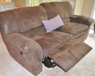 A VIEW OF THE SOFA PARTIALLY RECLINED.