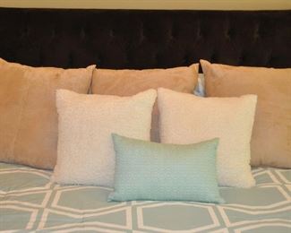 THREE 23" ULTRA SUEDE TAN PILLOWS.  OUR PRICE IS $65.00.  ALSO SHOWN ARE A PAIR OF POTTERY BARN 16" DOWN FILLED IVORY COLORED "SHEEPSKIN" PILLOWS.  OUR PRICE IS $50.00. (SOLD) TEAL DECORATIVE PILLOW INCLUDED WITH COMFORTER SET. (SOLD)