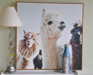 MORE LLAMA DECOR INCLUDES A OVERSIZED CANVAS FRAMED LLAMA, A LLAMA WATER BOTTLE AND A PETITE SILVER WITH JEWELS TABLE LAMP.  OUR PRICE IS $40.00.