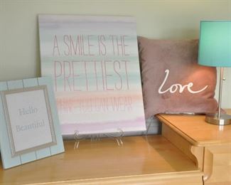 FOUR PIECE DECORATIVE ART SET INCLUDING: A "LOVE" PILLOW, A PETITE SILVER AND TURQUOISE LAMP; A LIGHT TURQUOISE  8" X 10" FRAME AND CANVAS WALL ARE "A SMILE IS THE PRETTIEST THING YOU CAN WEAR".  OUR PRICE IS $60.00 FOR THE SET.