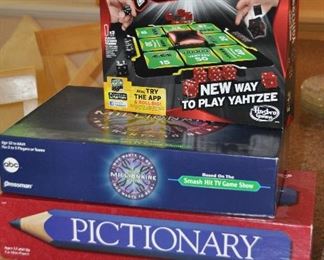 SET OF FOUR GAMES INCLUDING, WORLD SERIES YAHTZEE, WHO WANTS TO BE A MILLIONAIRE, PICTIONARY AND MONOPOLY MILLIONAIRE.  OUR PRICE FOR THE SET OF FOUR IS $50.00