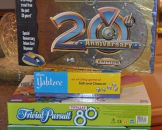 SET OF FIVE GAMES, INCLUDING: TRIVIAL PURSUIT 20TH ANNIVERSARY EDITION, YAHTZEE, TRIVIAL PURSUANT 80'S EDITION, MONOPOLY AND SCRABBLE.  OUR PRICE FOR THE SET OF FIVE IS $60.00.