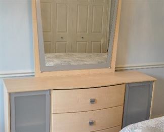 BLEACHED MAPLE WITH BRUSHED SILVER AND GLASS DOORS ALONG WITH 3 DRAWERS, 63"W X 17"D  X 32"H.  ALSO INCLUDED IS THE ATTACHED MIRROR, 40" X 41".  OUR PRICE IS $225.00.