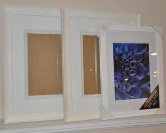 THREE PIECE SET OF WOODEN WHITE FRAMES.  14" X 18" (WITH MAT), (2) LARGE 19" X 23".  OUR PRICE IS $40.00 FOR THE SET.