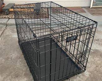 MEDIUM SIZE 30"W X 19"D X 21"H DOG CRATE.  OUR PRICE IS $22.00.