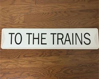 Lot 194
"To The Trains" plastic wall sign