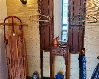 antique snow sled and hall tree