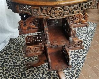 CHINESE REVOLVING TABLE WITH MARBLE TOP AND LION PAW FEET ALONG WITH DRAGON CARVING ON SHELVES, TEAK