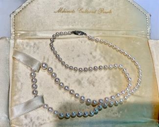 $300.00........Mikimoto Cultured Pearls, Sterling Clasp and Original Sachet Case 19" necklace