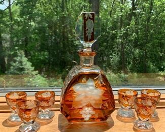 CLEARANCE!  $50.00 now, was $140.00......Beautiful Bohemia's Glass Cut Amber Decanter Set.  Decanter and 6 glasses, a few small chips in the small glasses but still very beautiful.  