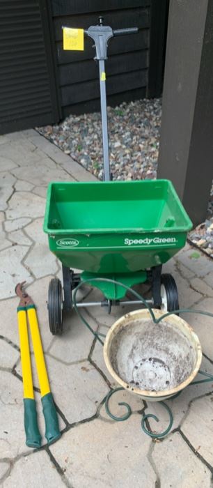 REDUCED!  $10.50 now, was $14.00......GARAGE LOT 106 Lawn Spreader, Trimmer and Plant Stand
