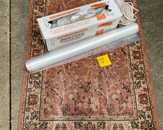 CLEARANCE !    $5.00 now, was $12.00 for all......Rug as is, one side has fading, and 2 rolls of Plastic  GARAGE LOT 95