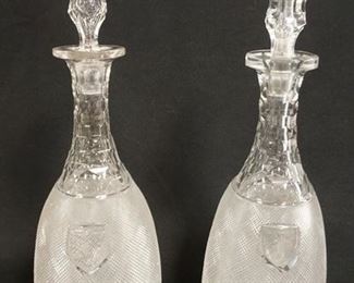 1013	PAIR OF EXCEPTIONAL BLOWN & CUT DECANTERS W/HOLLOW BLOWN STOPERS AND FINE HONEYCOMB & CROSSHATCH CUTTING, EACH HAS A MONOGRAMMED SHIELD MEDALLION, 13 1/4 IN HIGH

