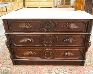 1024	MARBLE TOP VICTORIAN 3 DRW, DRESSER HAS BEVELED MARBLE W/ ROUNDED FRONT CORNERS & CARVED GRAPE CLUSTER PULLS, 45 1/2 IN W, 29 1/4 IN H 
