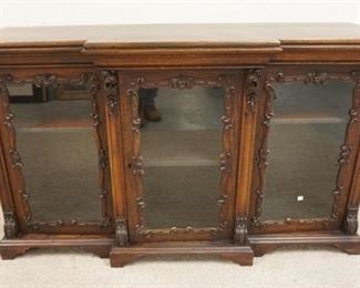 1043	VICTORIAN CARVED 3 DRAWER CREDENZA IN THE MANNER OF MEEKS HAS 3 GLASS DOORS & 2 SECRECT DOORS ON EITHER SIDES, 60 IN W, 35 IN H 
