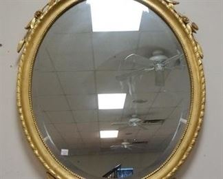 1098	DECORATIVE ARTS INC. ORNATE OVAL GILT BEVELED MIRROR, OVERALL DIMENSIONS 25 1/2 IN X 46 IN
