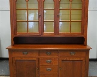 1112	GIHON VALLEY FURNITURE COMPANY  2 PIECE CHERRY CUPBOARD, HAS A GLASS DOOR TOP INDIVIDUALLY PANED BASE HAS 6 DRAWERS & 2 DOORS, HAS DOVETAILED BRACKET FEET, 68 IN W, 84 IN H 
