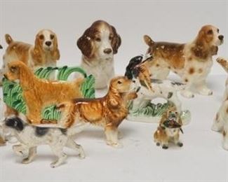 1130	GROUP OF 14 DOG FIGURES, LOT INCLUDES ONE HUTSCHENREUTHER, ONE ROYAL DOULTON, ONE CARVED WOOD, ONE METAL, ONE WALL POCKET, TALLEST IS 5 1/4 IN 
