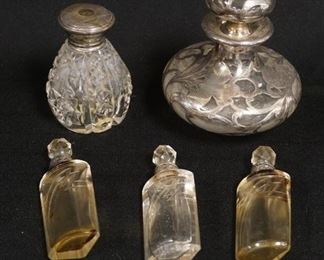 1132	FIVE PERFUME BOTTLES W/ STERLING SILVER, SET OF 3 CUT BOTTLES W/ 935 COLLARS & CUT STOPPERS, CUT PERFUME W/ STERLING CAP & A SILVER OVERLAY PERFUME W/ ORIGINAL STOPPER THAT HAS CLOUDINESS INSIDE, TALLEST IS 4 1/4 IN 

