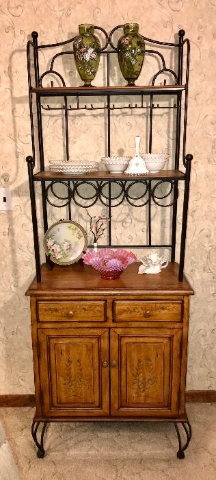 PRICE: $110.00 Wine Bottle + Glass rack Cabinet with Decorative Tole Painted and Black Iron framing details. 
Measures: 73”Tall • 15”Deep • 27.5”Wide 
Item#65474