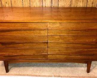 PRICE: $420.00  MCM Walnut Dresser, 6 drawer Concave Flared Linear drawer pulls. I find NO manufacturer. BUT I believe it’s Young Manufacturing. 
Measures:  53.75”Long • 31”Tall • 18.5”Deep 
Item#65457