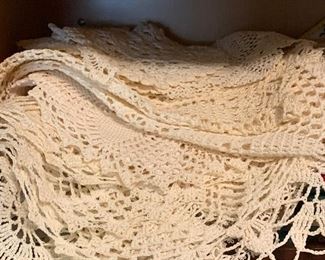 Large selection of vintage doilies.