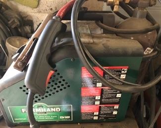 Farmhand MIG welder! I believe there’s a bottle of shielding gas with it.  
