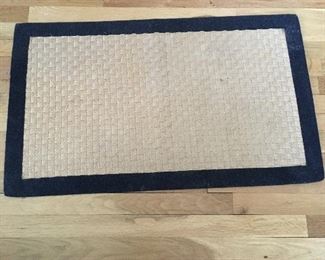 Item #105:  Doormat.  approx. 2.5'x18".  $5