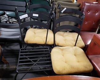 (4) Black Wrought Iron heavy steel indoor outdoor stack chairs $300 for 4