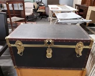 Vintage Black Vinyl with brass hardware trunk Measures: 31.25"W x 17"D x 15.5"H closed Call