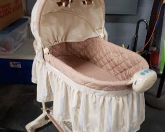 Isis Inc Canada model # B4410DNS Childs bassinet with It has a nightlight and attached music module that features a selection of pre-loaded lullabies that will help gently send your newborn to sleep $40 