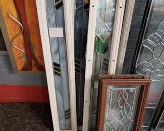 Assorted Low E double panel stain & leaded glass inserts Offering 30% off all remaining stock. Original price starts $95 to $575 before discount.    FEATURED   Small in front 7.5"w X 18.5"h WAS $95  NOW $75 WITH DISCOUNT  In Back 2 styles  (3) Geometrical on left & (1) Tulip on right 4"w x 33.5"H Was $150 Now $100 each WITH DISCOUNT