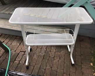 Metal utility cart on casters