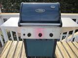 Vermont Castings grill with propane tank